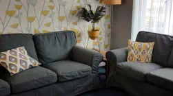 Two sofas in room used for social and crisis support
