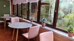 tables and chairs in conservatory
