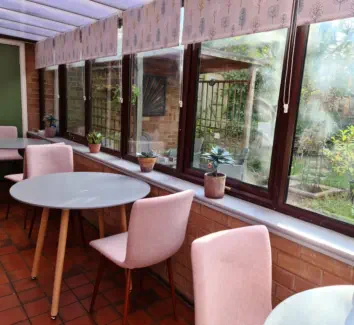 tables and chairs in conservatory