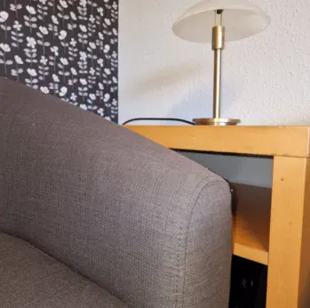 Close up photo of armchair and lamp in the counselling/meeting room